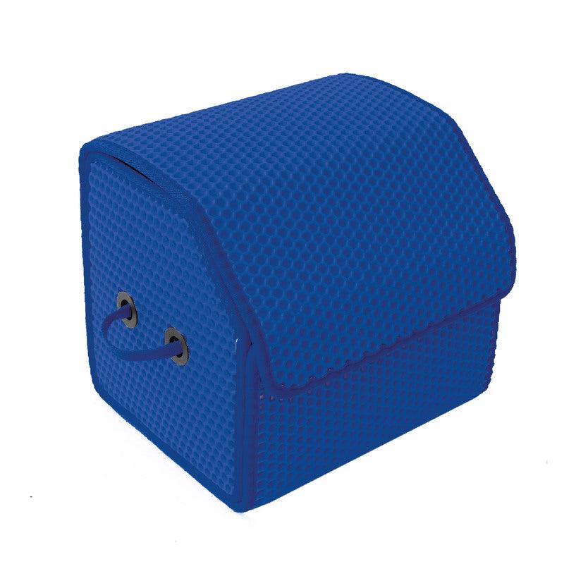 Blauer Organizer mit Wabenmuster und zwei Löchern zum Tragen.