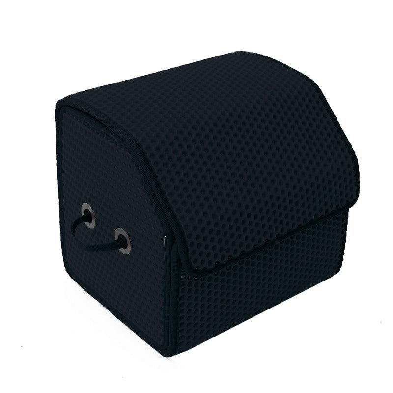 Schwarze Aufbewahrungstasche mit strukturiertem Material und Griffen.